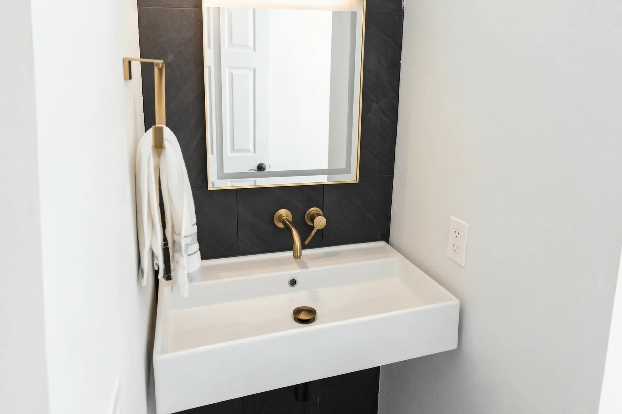Whole-home remodel — vanity with brass fixtures, Orange, Avorino