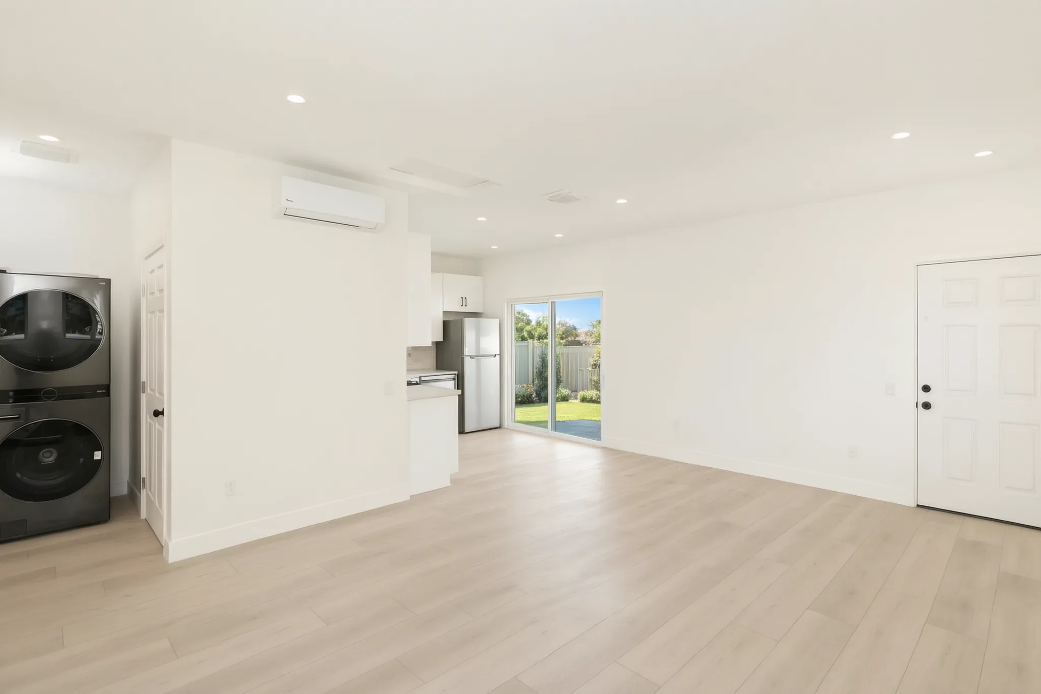Garage conversion ADU — living area with laundry closet, Brea, Avorino