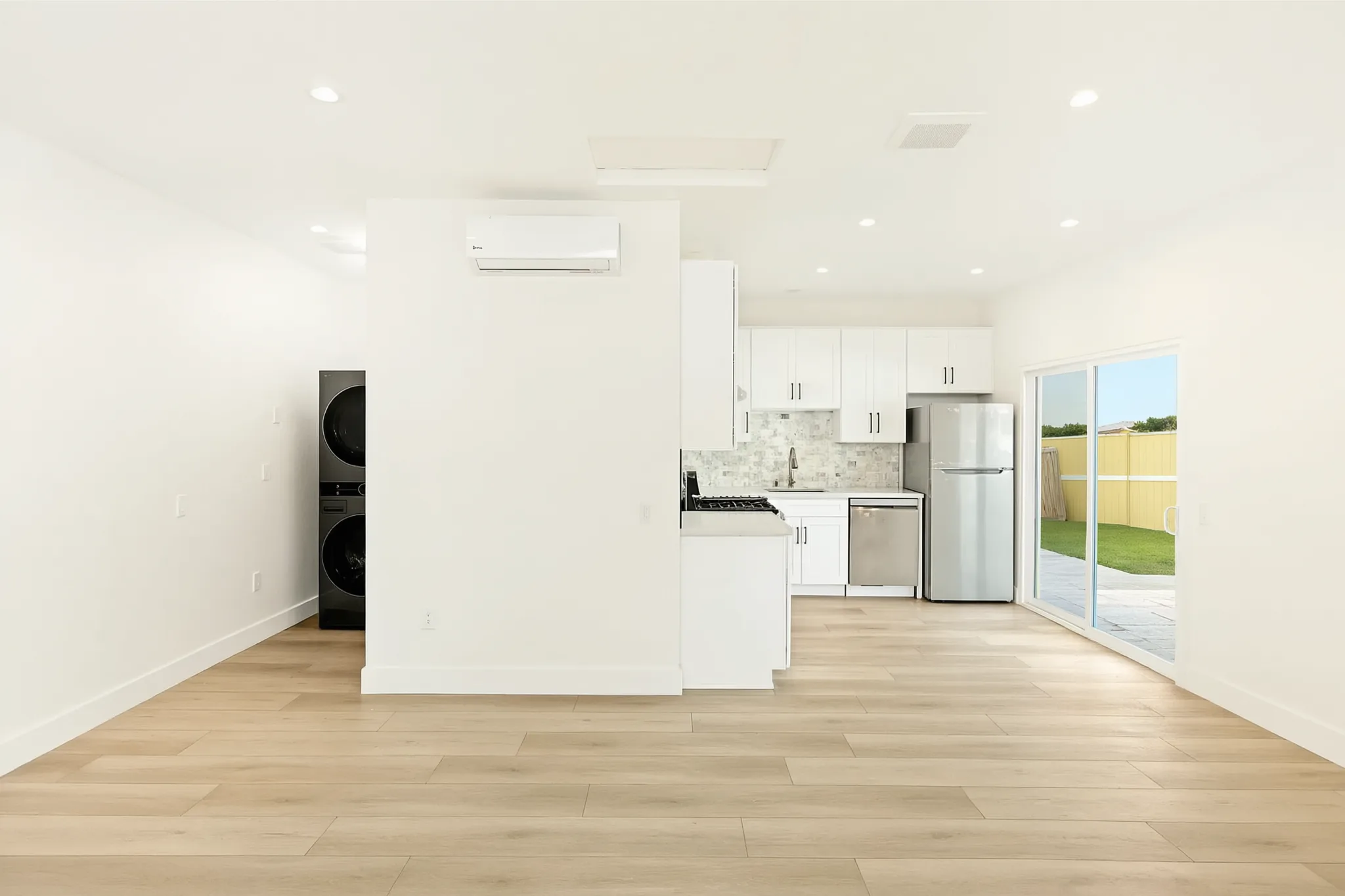 Garage conversion ADU — kitchen and laundry from the living area, Brea, Avorino