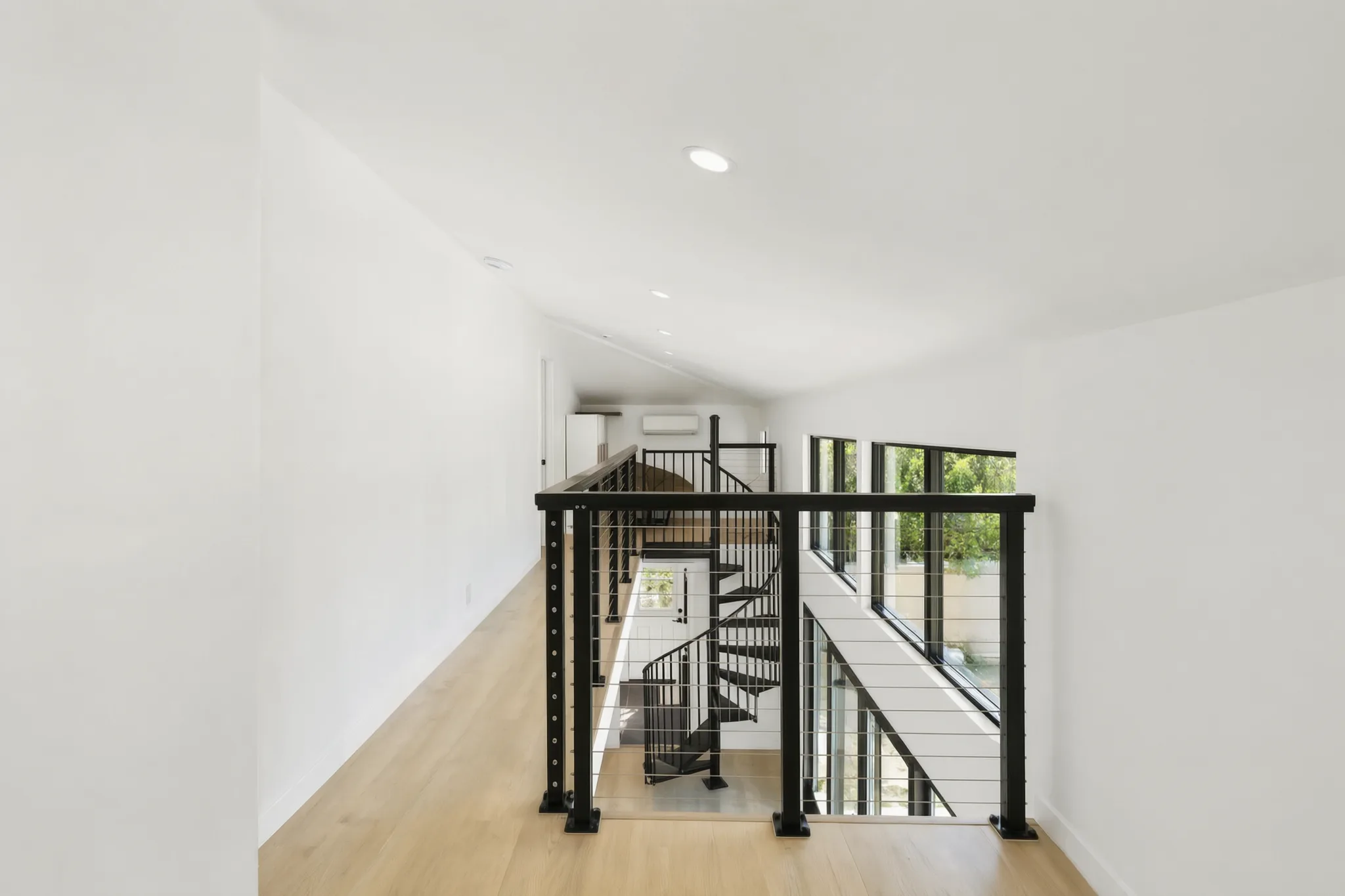 Two-story detached ADU — loft with cable-rail overlooking the living room, Santa Ana Hills, Avorino