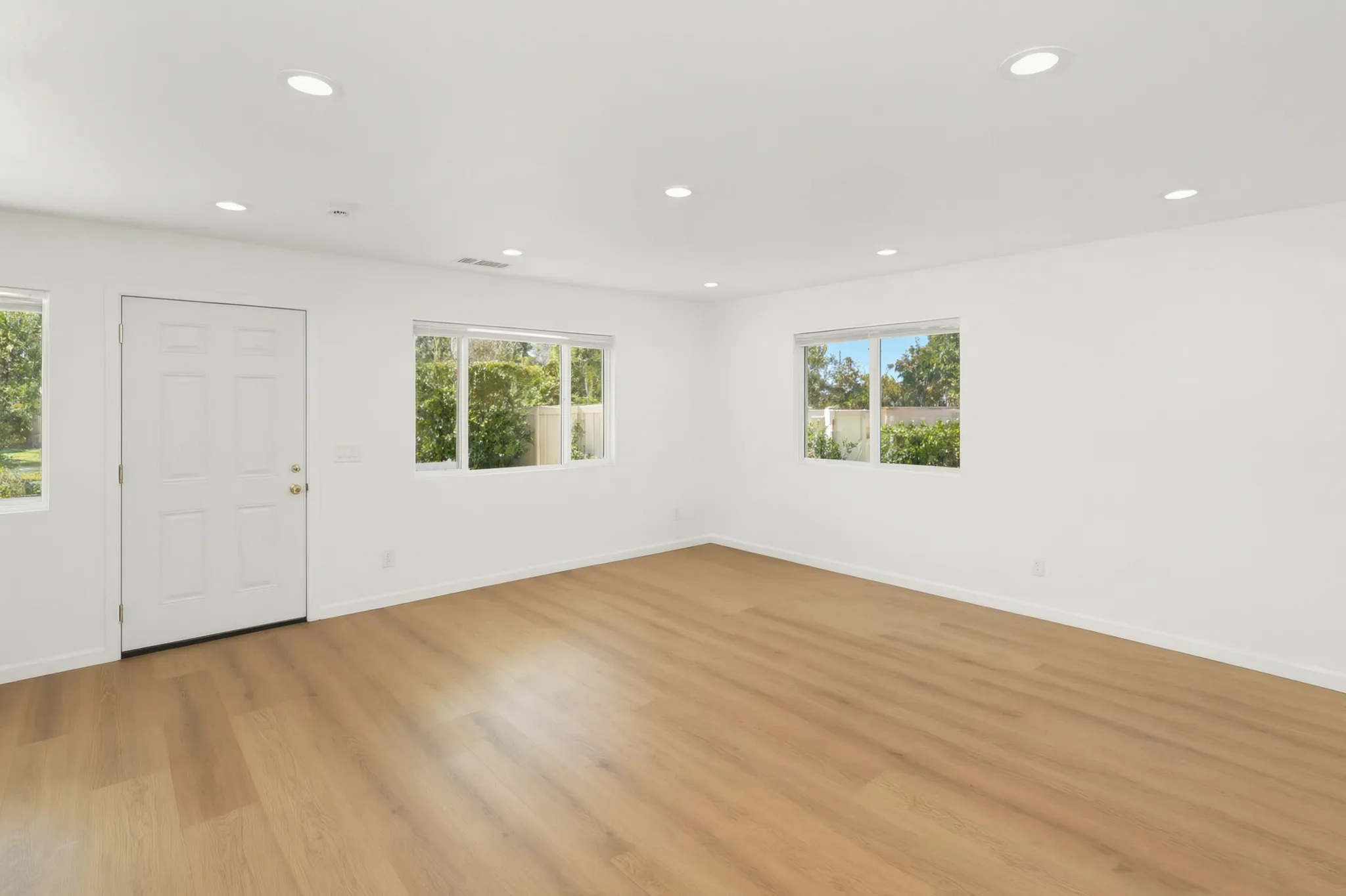 Detached ADU — living room, entry door and front windows, Buena Park, Avorino