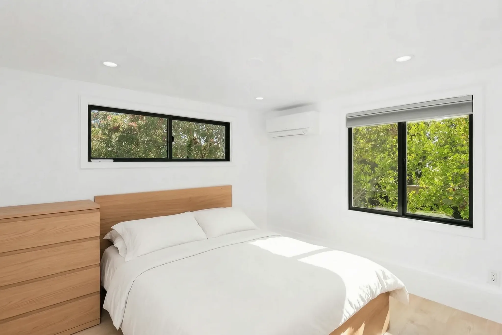 Detached ADU bedroom with crisp white bedding, Santa Ana Hills, Avorino