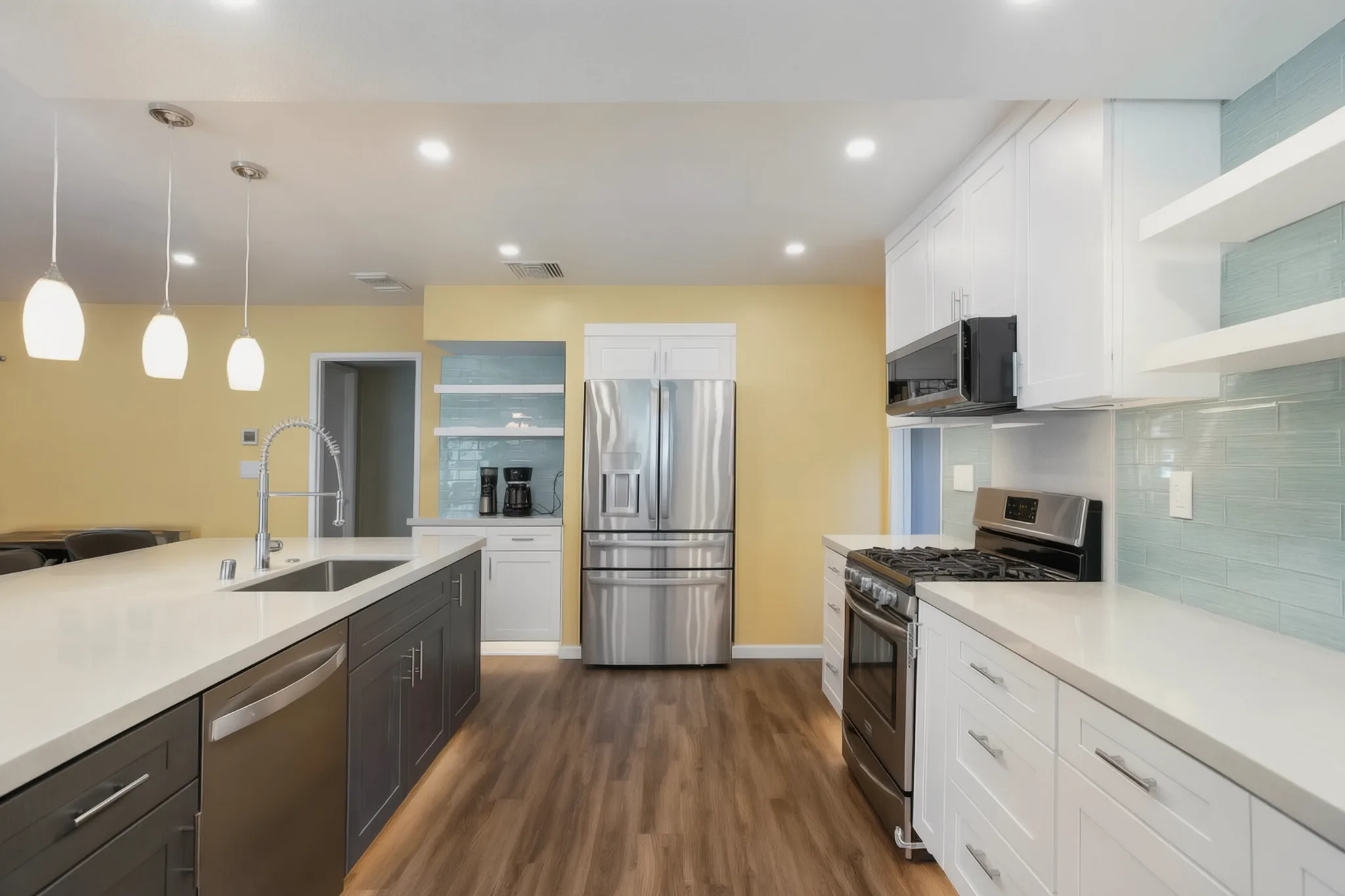 Open-concept kitchen remodel — glass-tile backsplash and range wall, Orange, Avorino