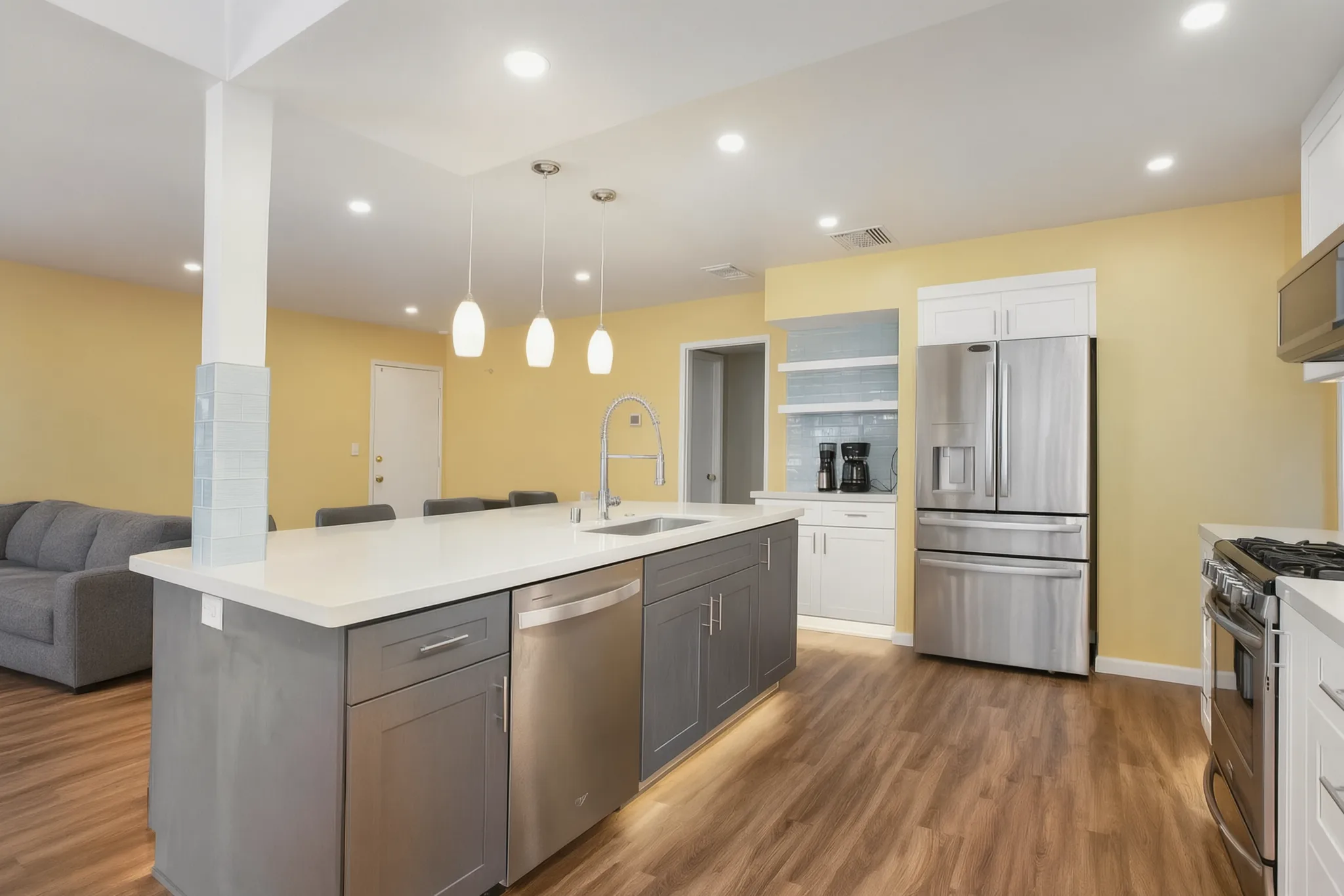 Open-concept kitchen remodel — island toward the fridge wall, Orange, Avorino