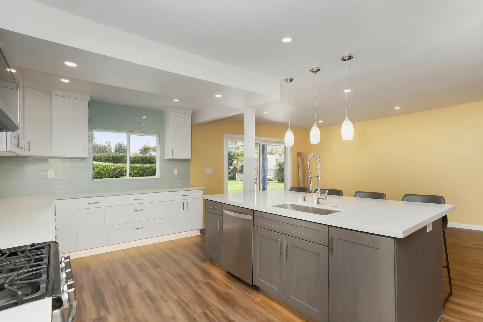 Open-concept kitchen remodel — island toward the window, Orange, Avorino