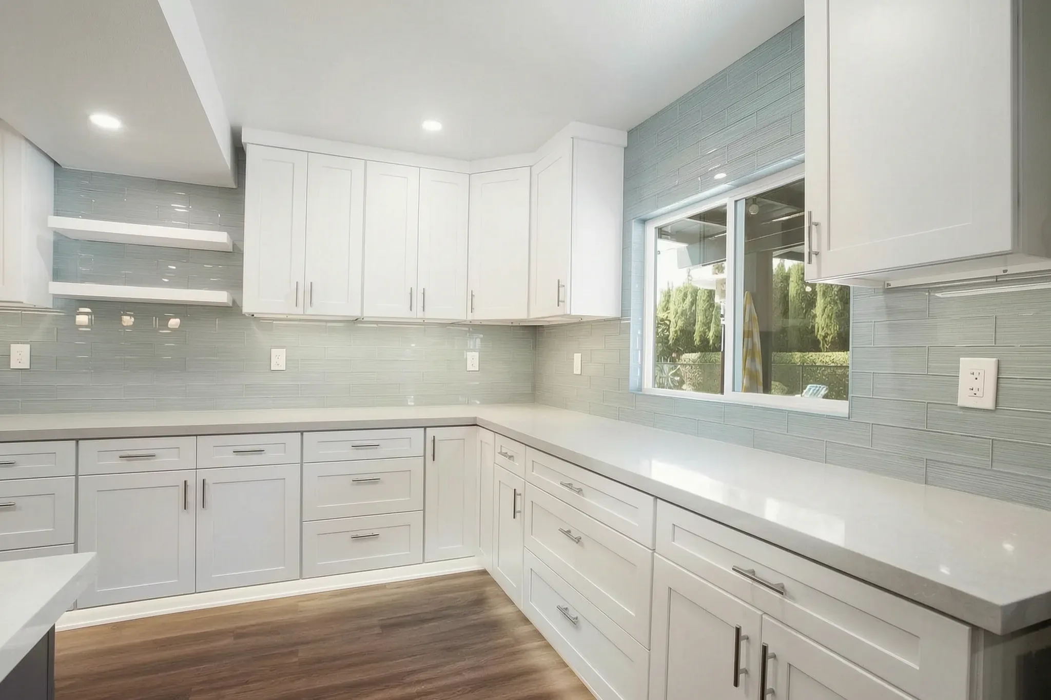 Open-concept kitchen remodel — counter run under the window, Orange, Avorino