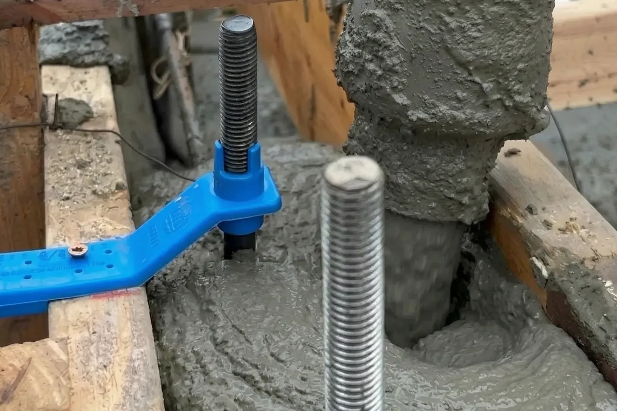 Pool house under construction — anchor bolt set in fresh concrete, San Juan Capistrano, Avorino