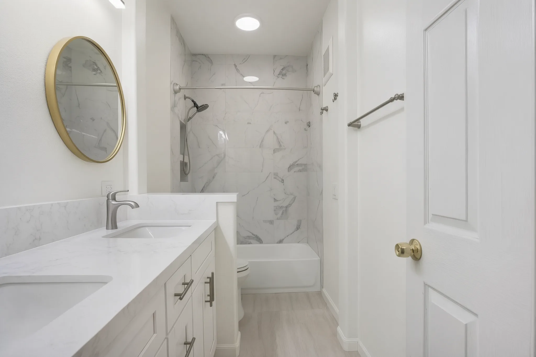 Primary bath renovation — double vanity and marble tub surround, Irvine, Avorino