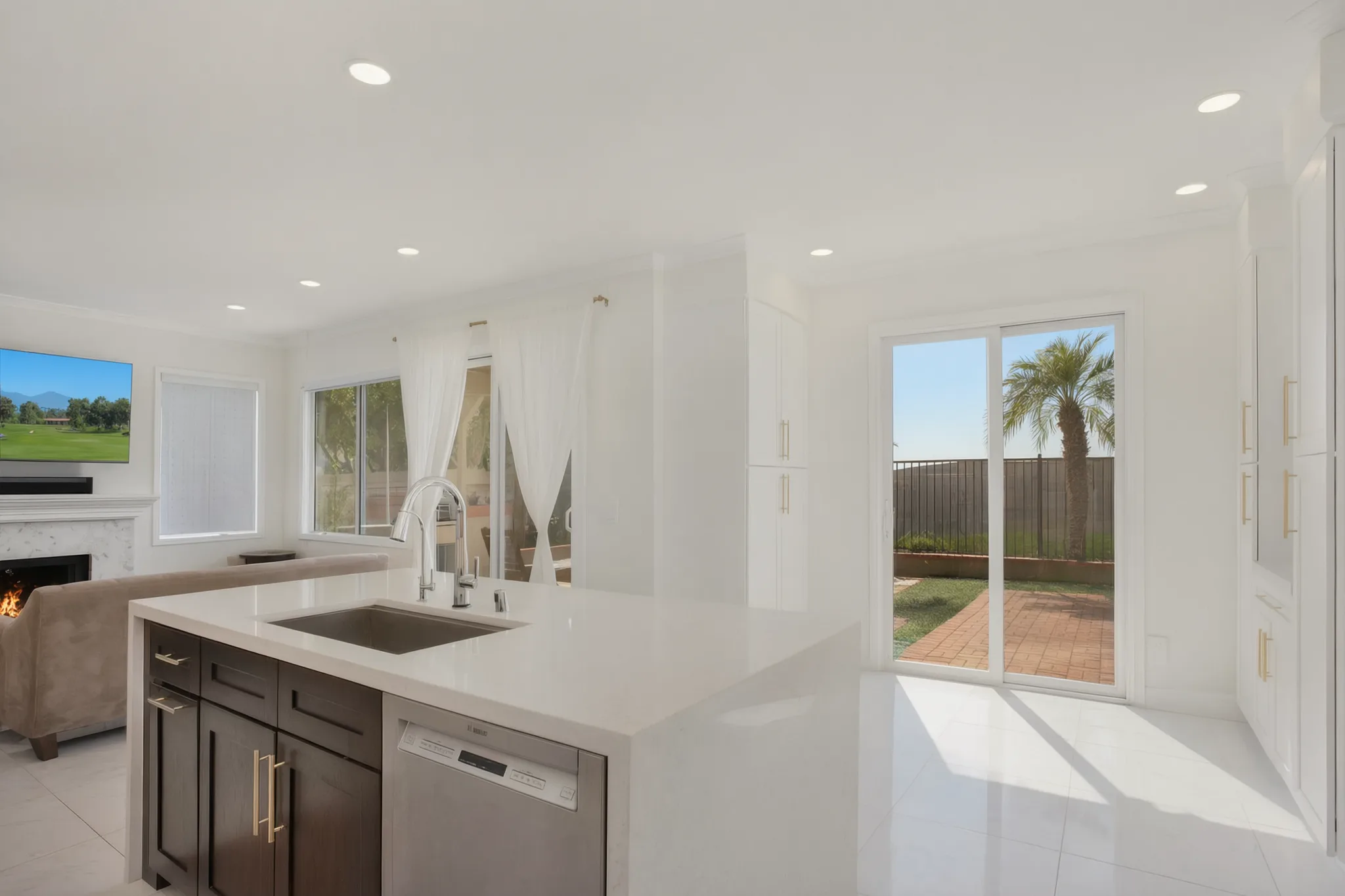 Custom home — island and sink with the yard beyond, Aliso Viejo, Avorino