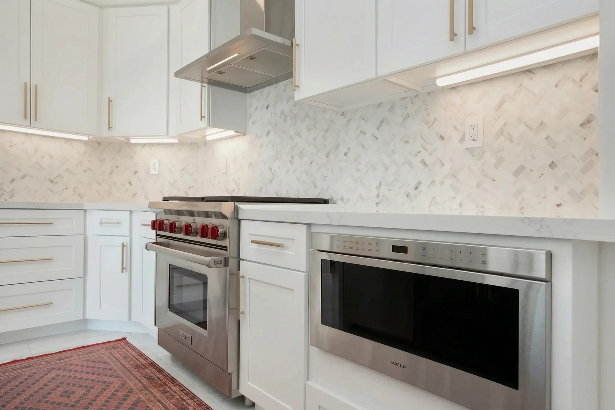 Custom home — range wall with herringbone marble backsplash, Aliso Viejo, Avorino