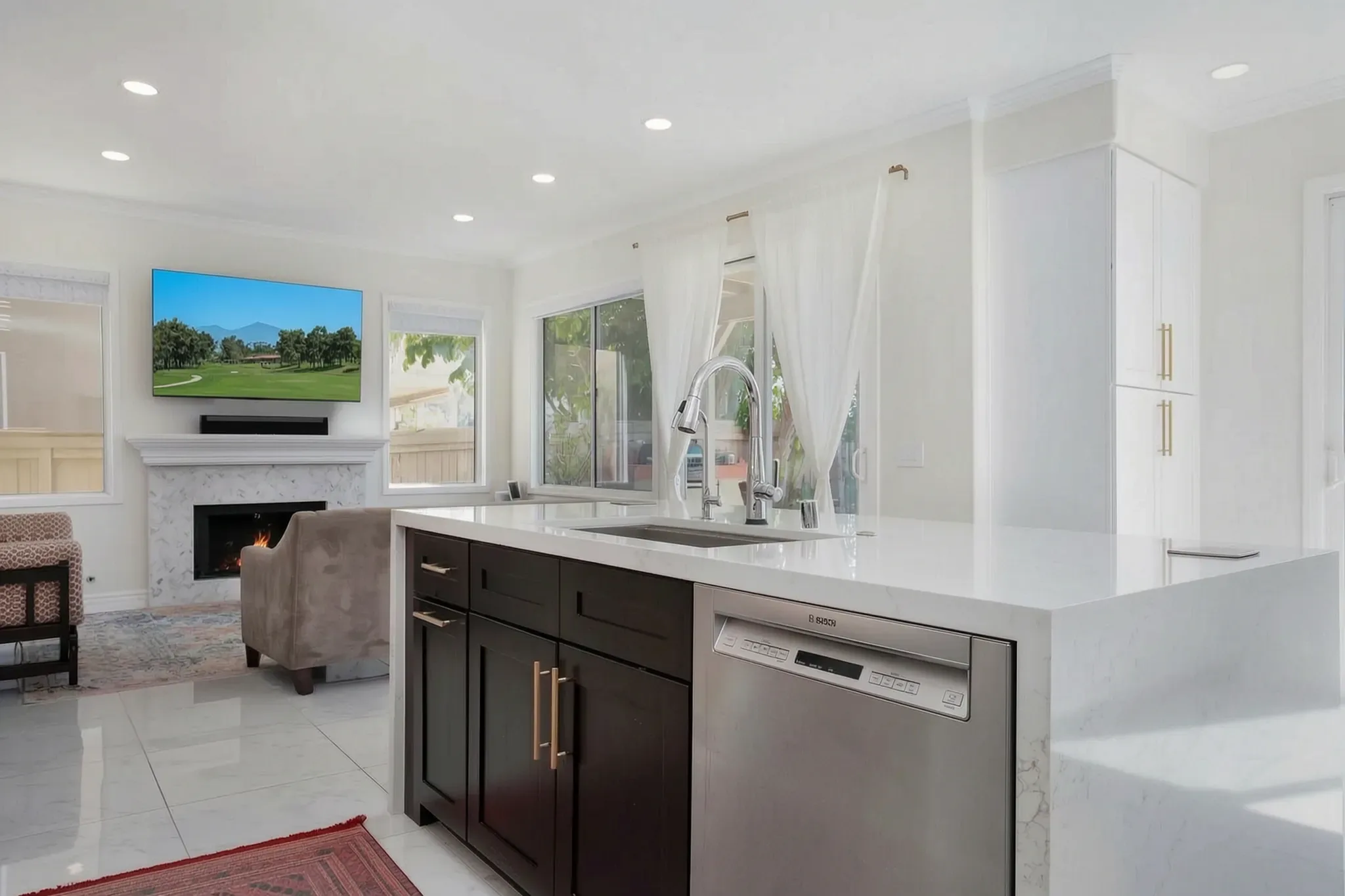 Custom home — kitchen island with the family room beyond, Aliso Viejo, Avorino