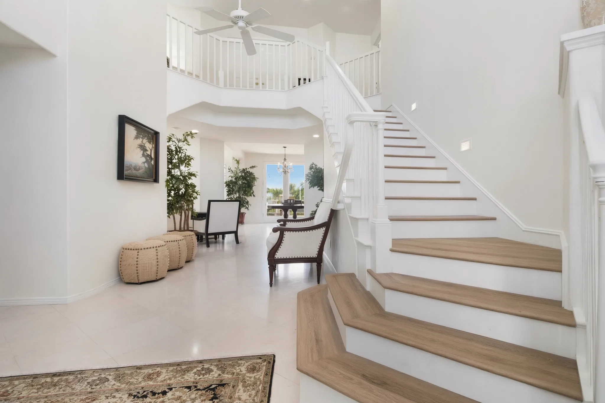Hillside custom home in Laguna Niguel: the entry and staircase, built by Avorino