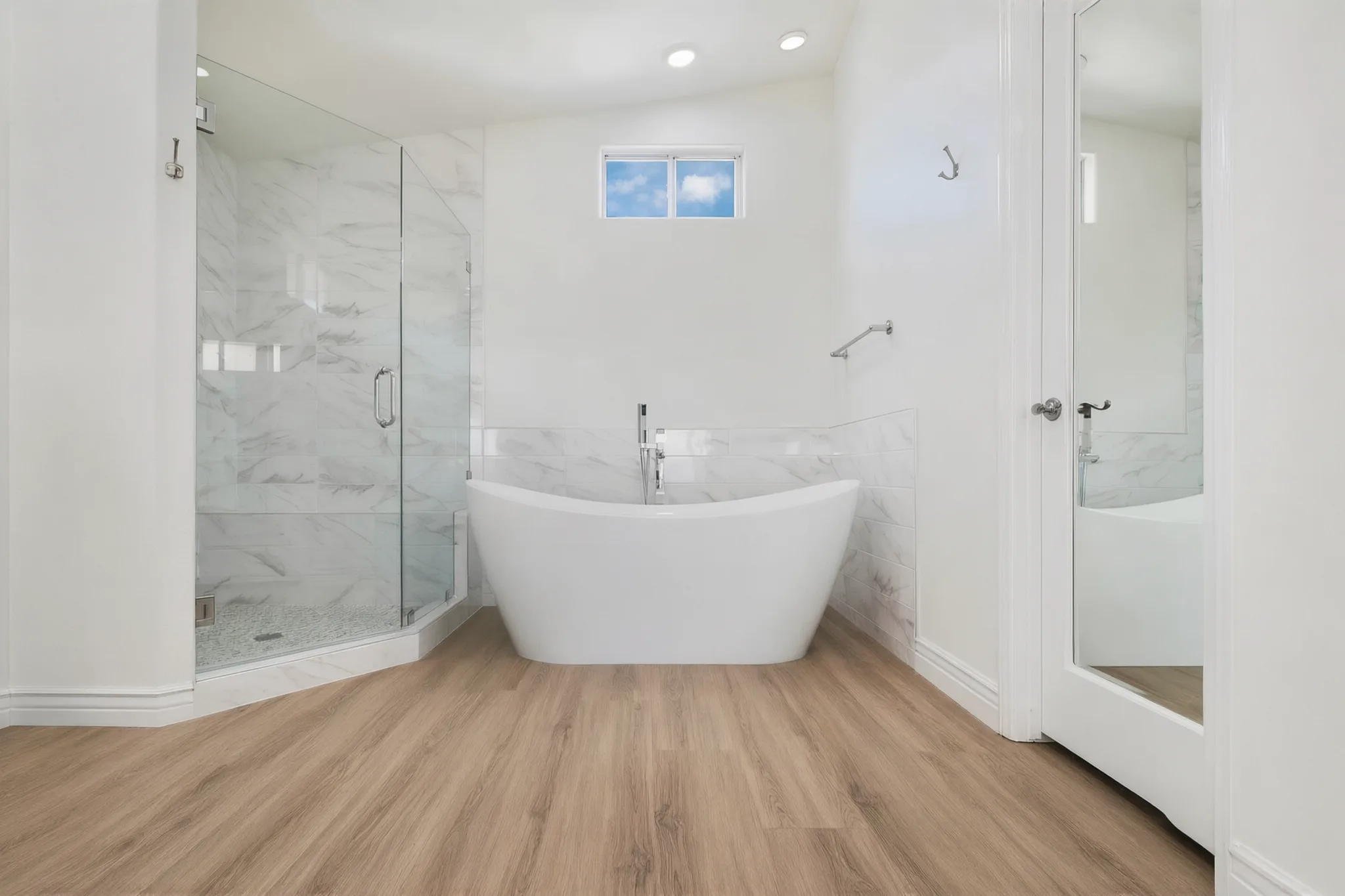 Hillside custom home — primary bath with freestanding tub and glass shower, Laguna Niguel, Avorino