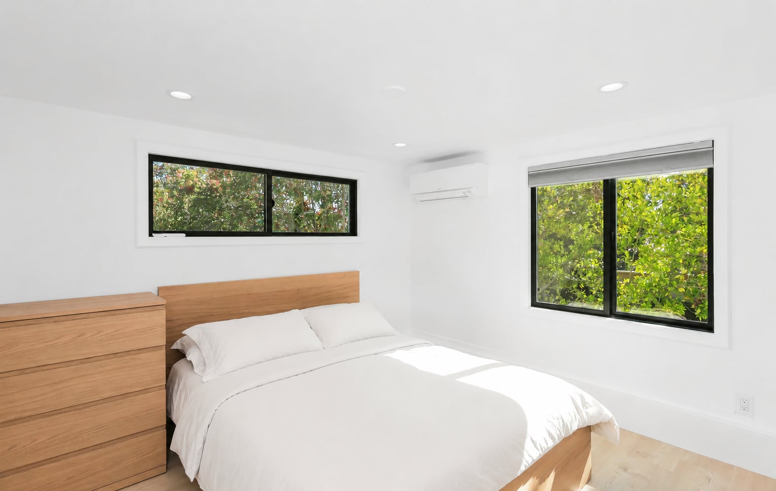 Detached ADU bedroom with crisp white bedding, Santa Ana — Avorino