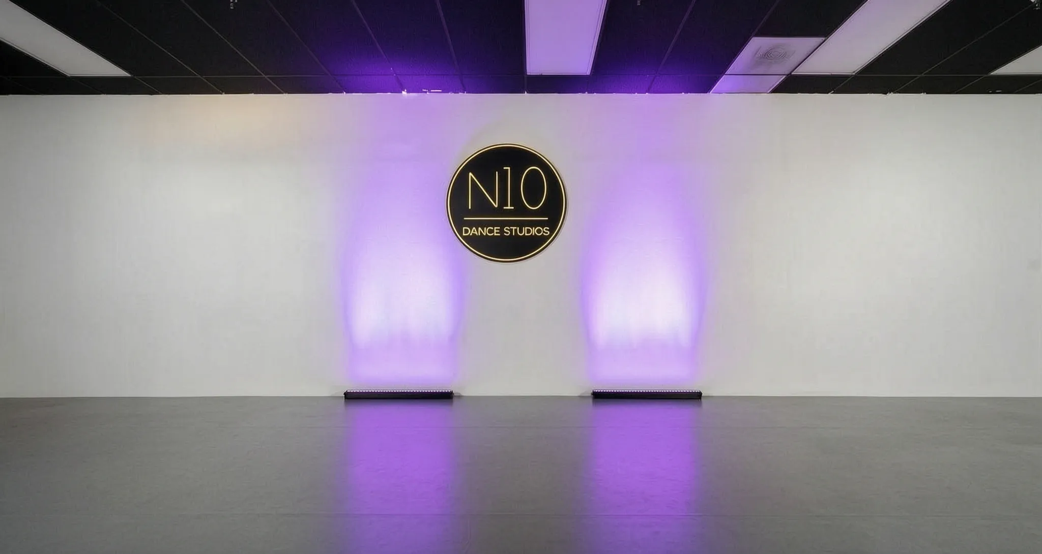 N10 Dance Studio branded feature wall with lighting, Orange County