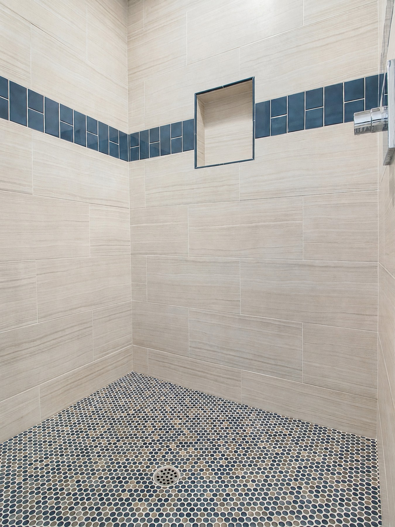 Primary bath remodel — marble shower with navy tile band, Avorino