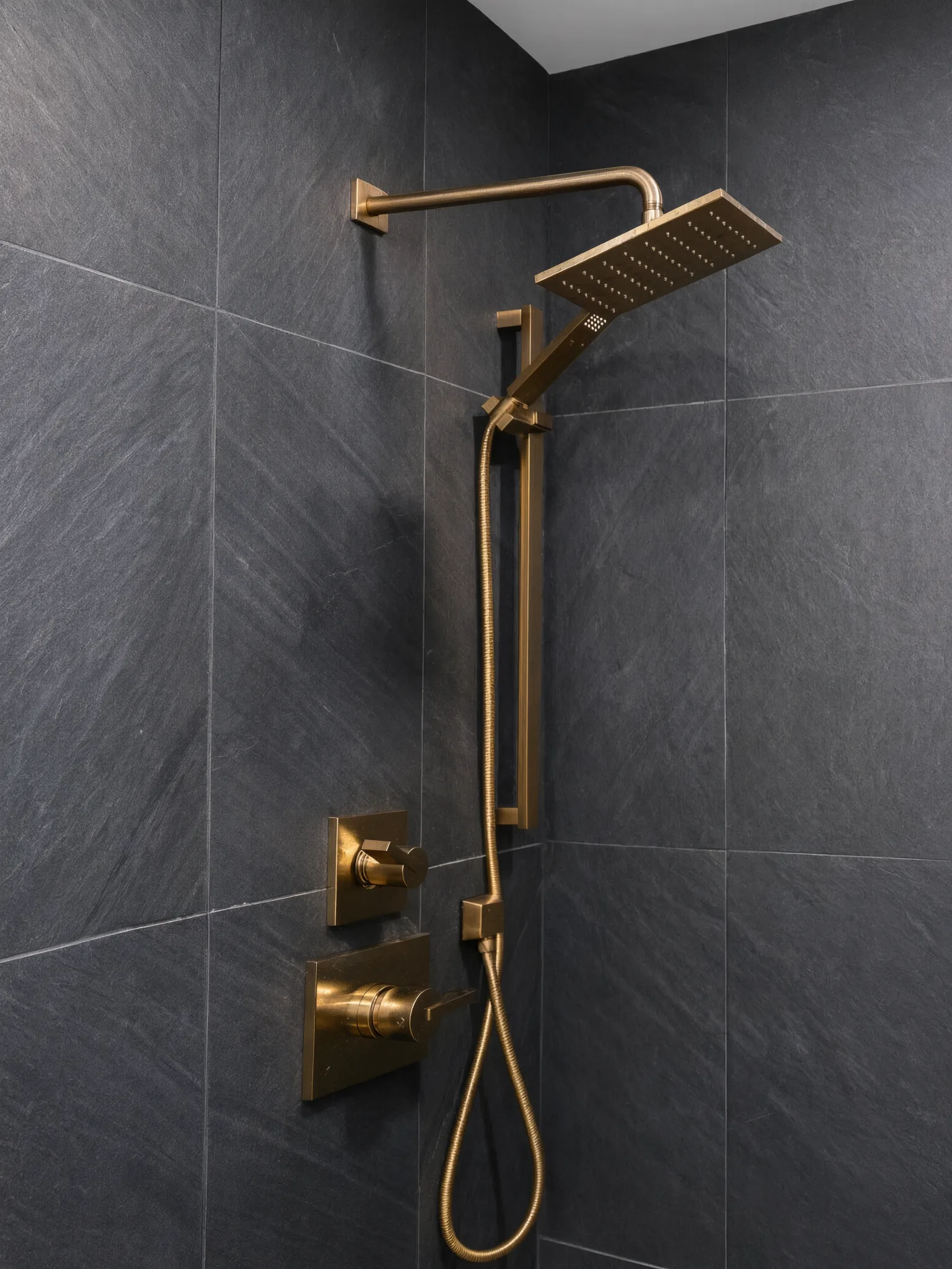 Whole-home remodel — brass shower fittings on slate tile, Orange, Avorino