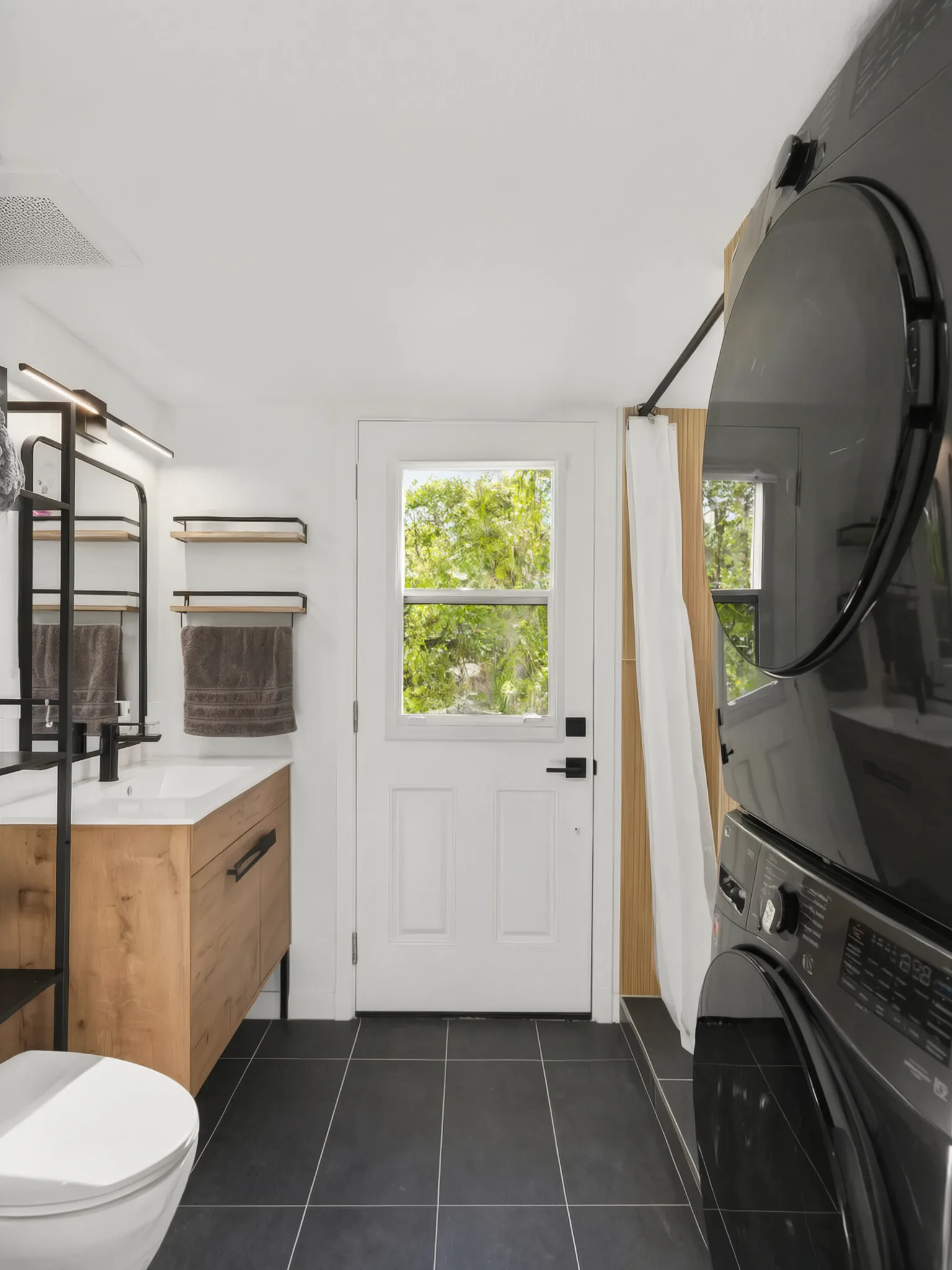 Two-story detached ADU — bath and laundry toward the entry, Santa Ana Hills, Avorino