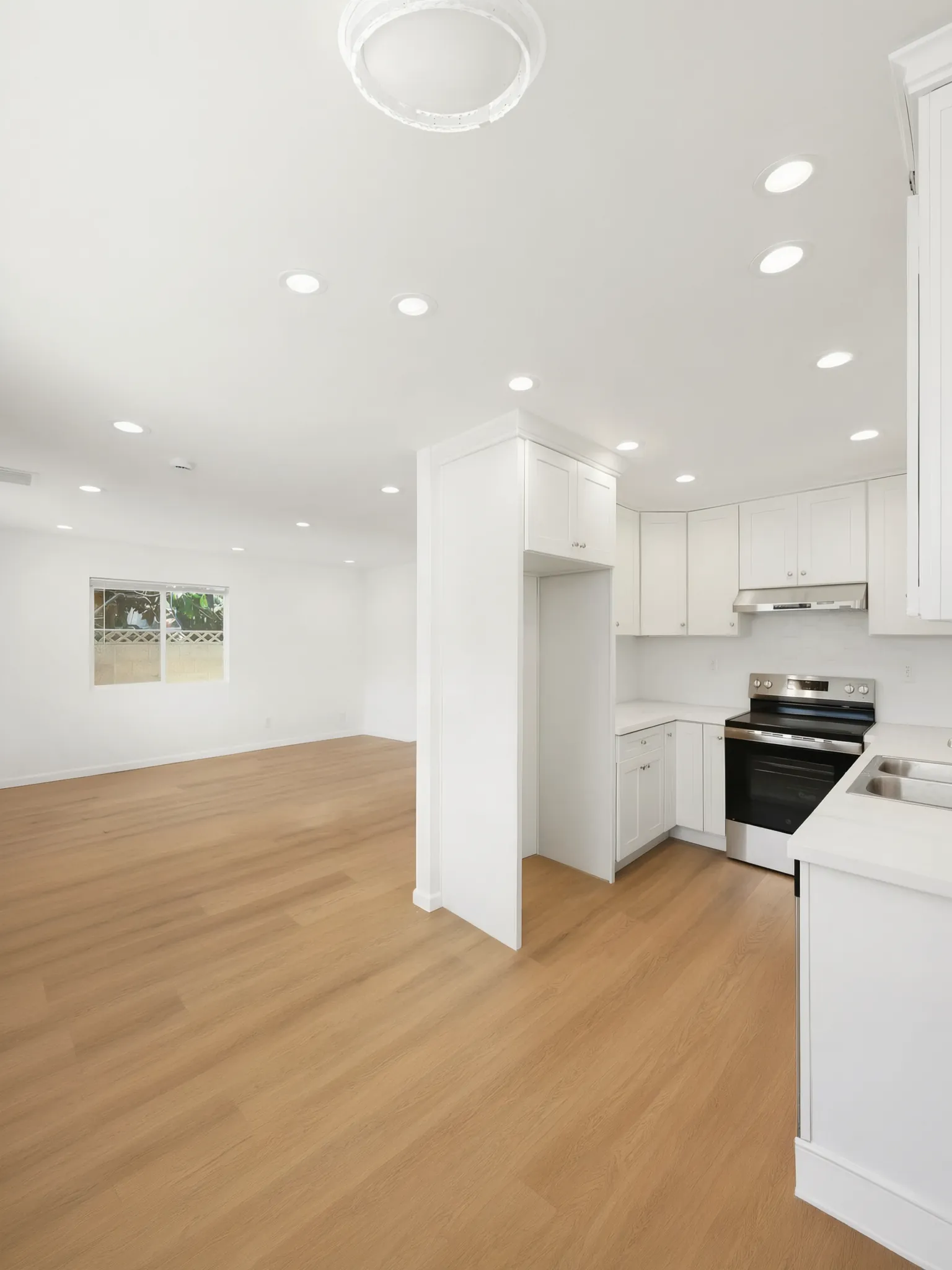The open living room and kitchen of a detached ADU in Buena Park, built by Avorino