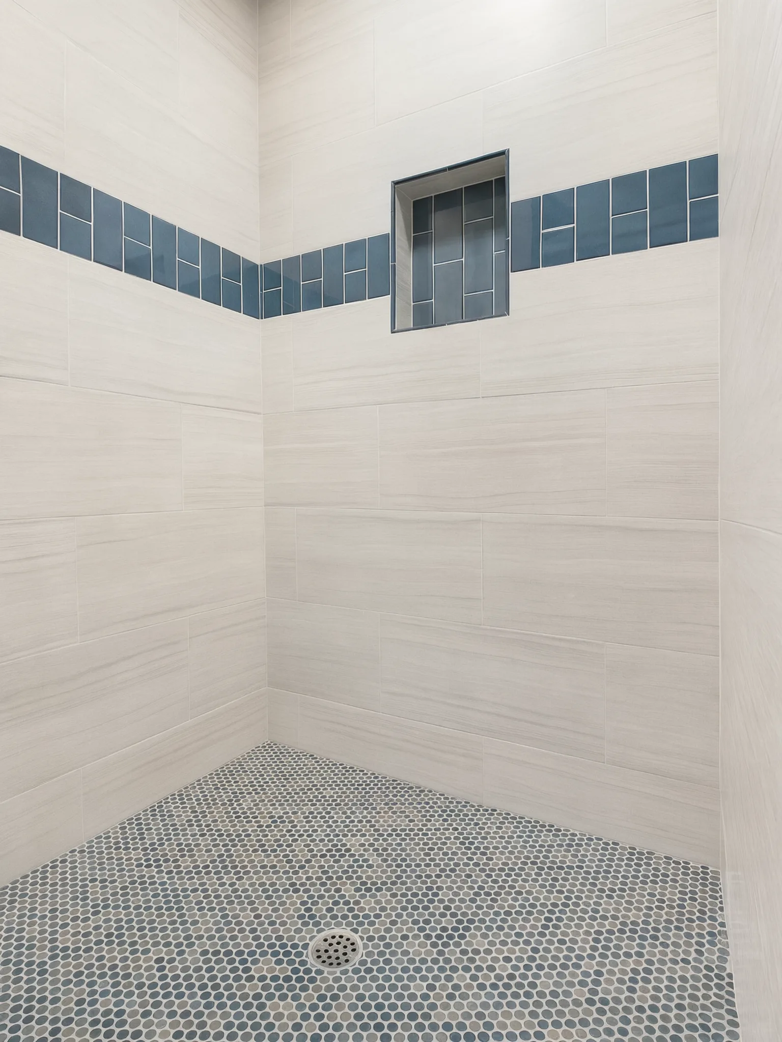 Primary bath remodel — shower niche and penny-tile floor, Mission Viejo, Avorino