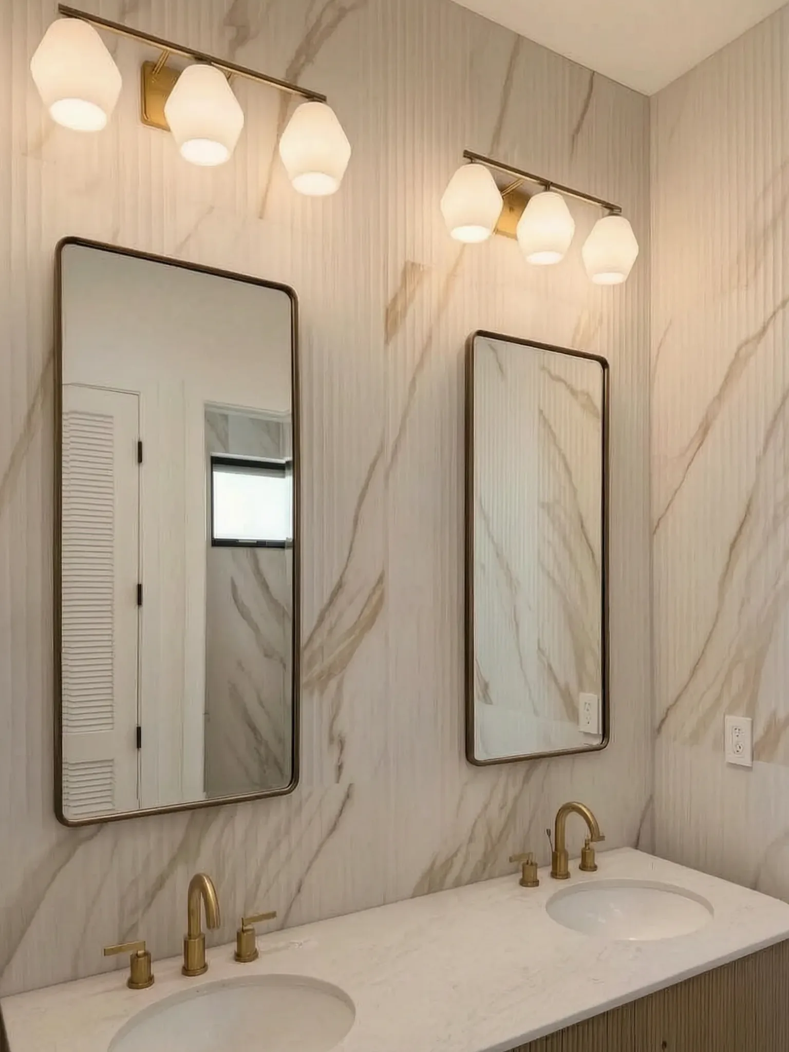 Custom pool house — double vanity with brass sconces, San Juan Capistrano, Avorino
