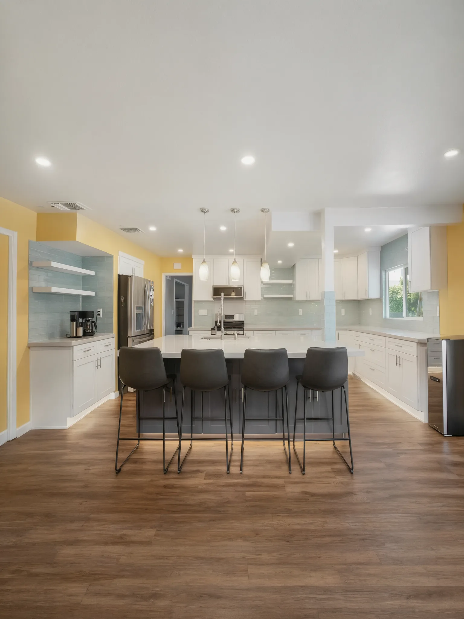 Open-concept kitchen remodel — island seating and pendant lights, Orange, Avorino