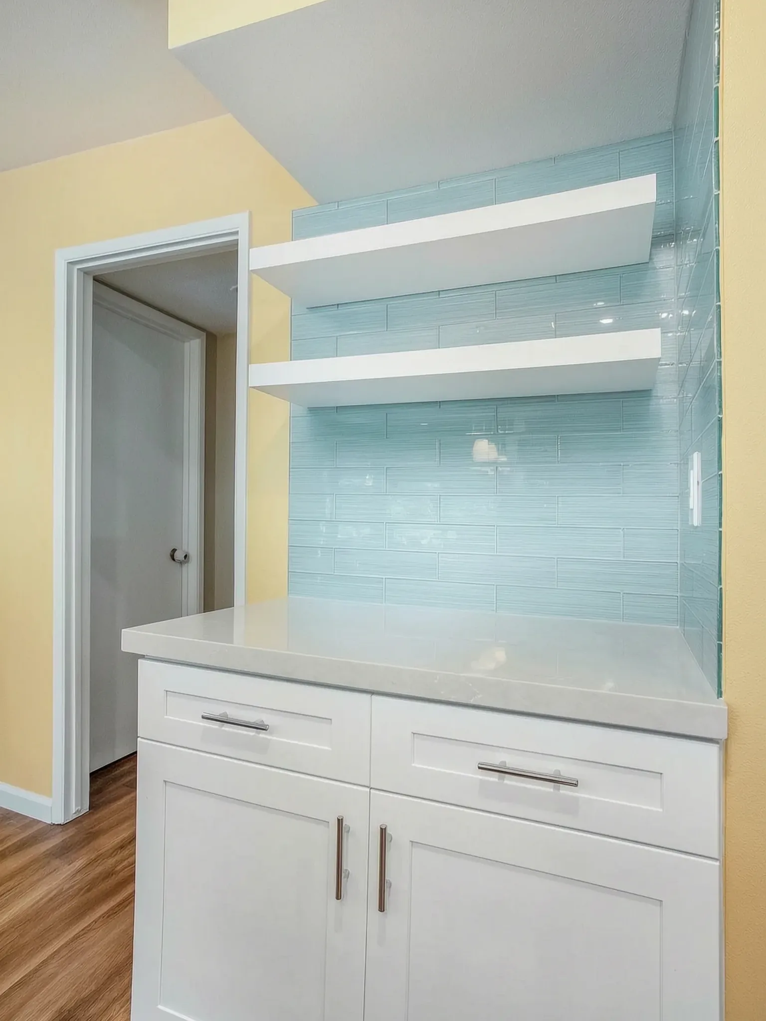 Open-concept kitchen remodel — floating shelves on glass tile, Orange, Avorino