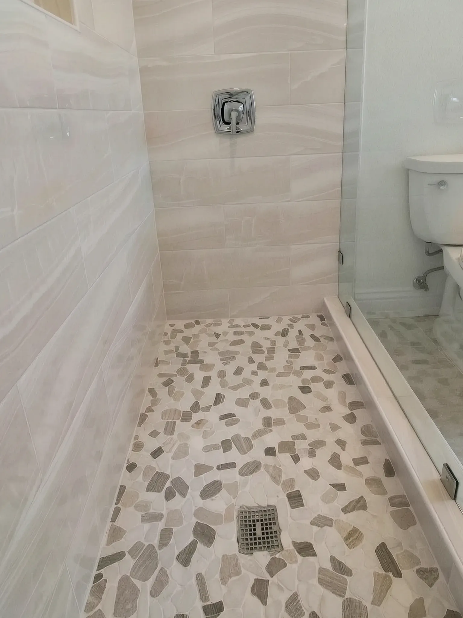 Whole-home remodel — walk-in shower with pebble floor, Laguna Niguel, Avorino