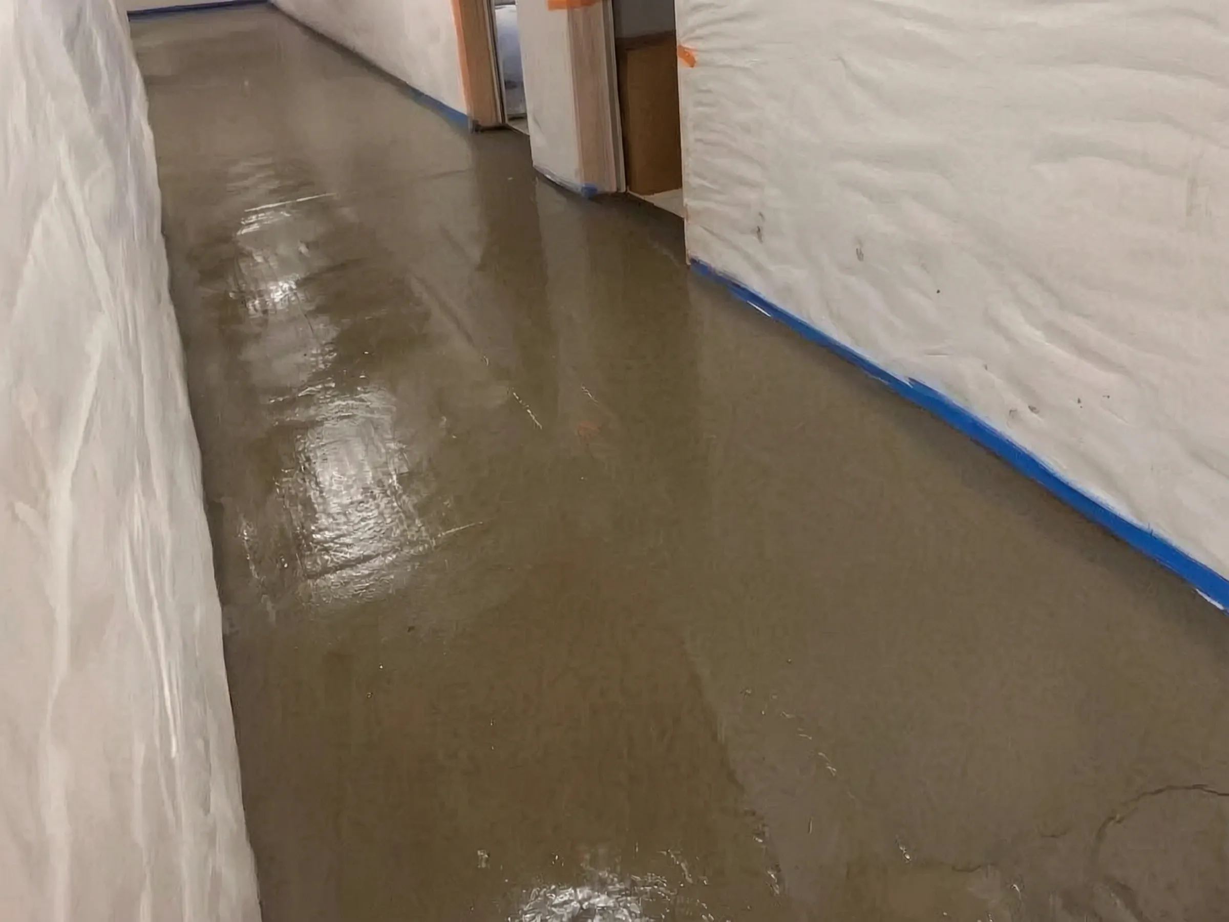 Floor levelling poured along the corridor before the finish floor. N10 Dance Studio, Tustin, built by Avorino.