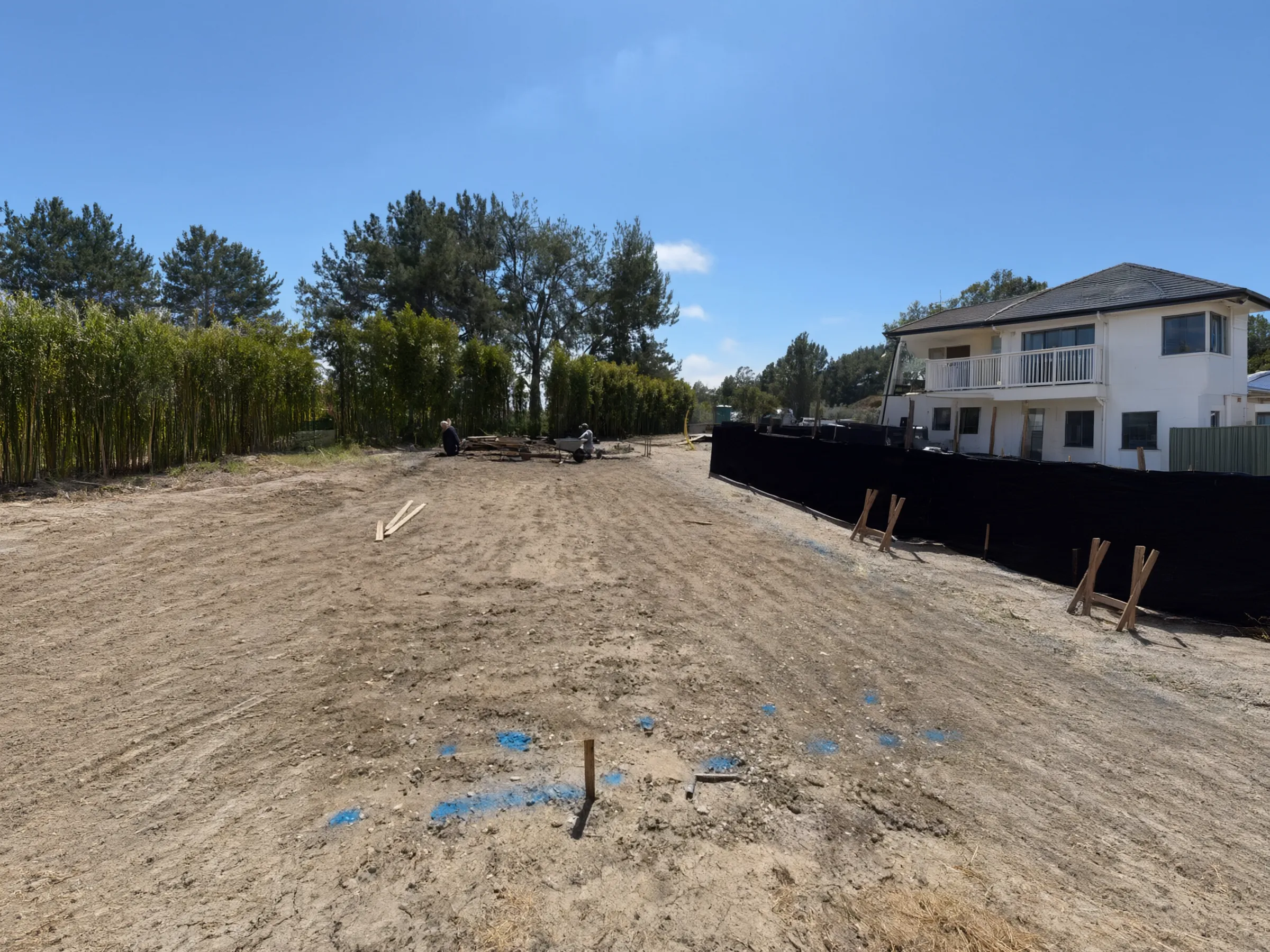 A cleared, staked lot, ready for the foundation. Pool house, San Juan Capistrano, built by Avorino.