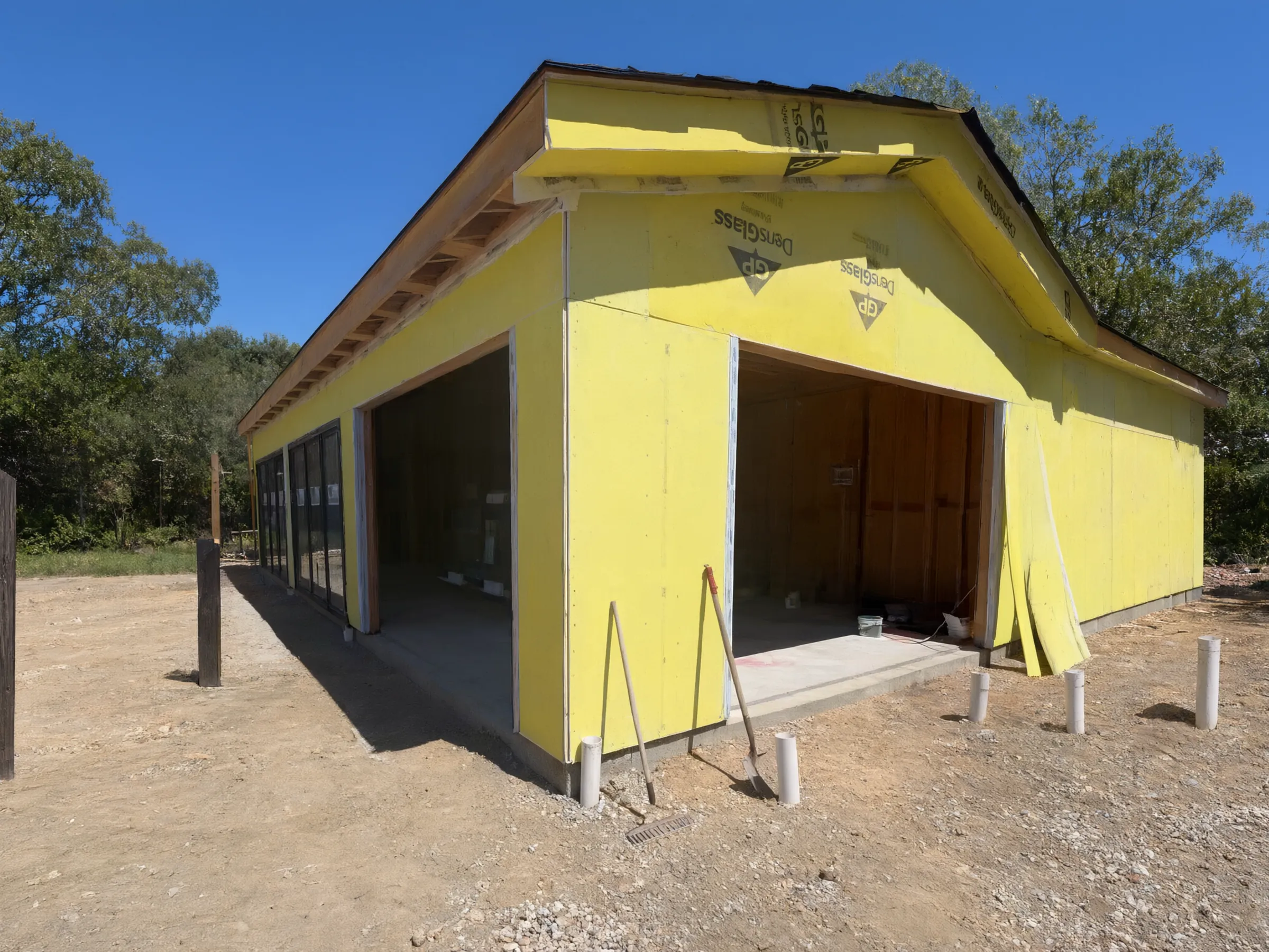 Walls sheathed, with large openings for the glass doors. Pool house, San Juan Capistrano, built by Avorino.