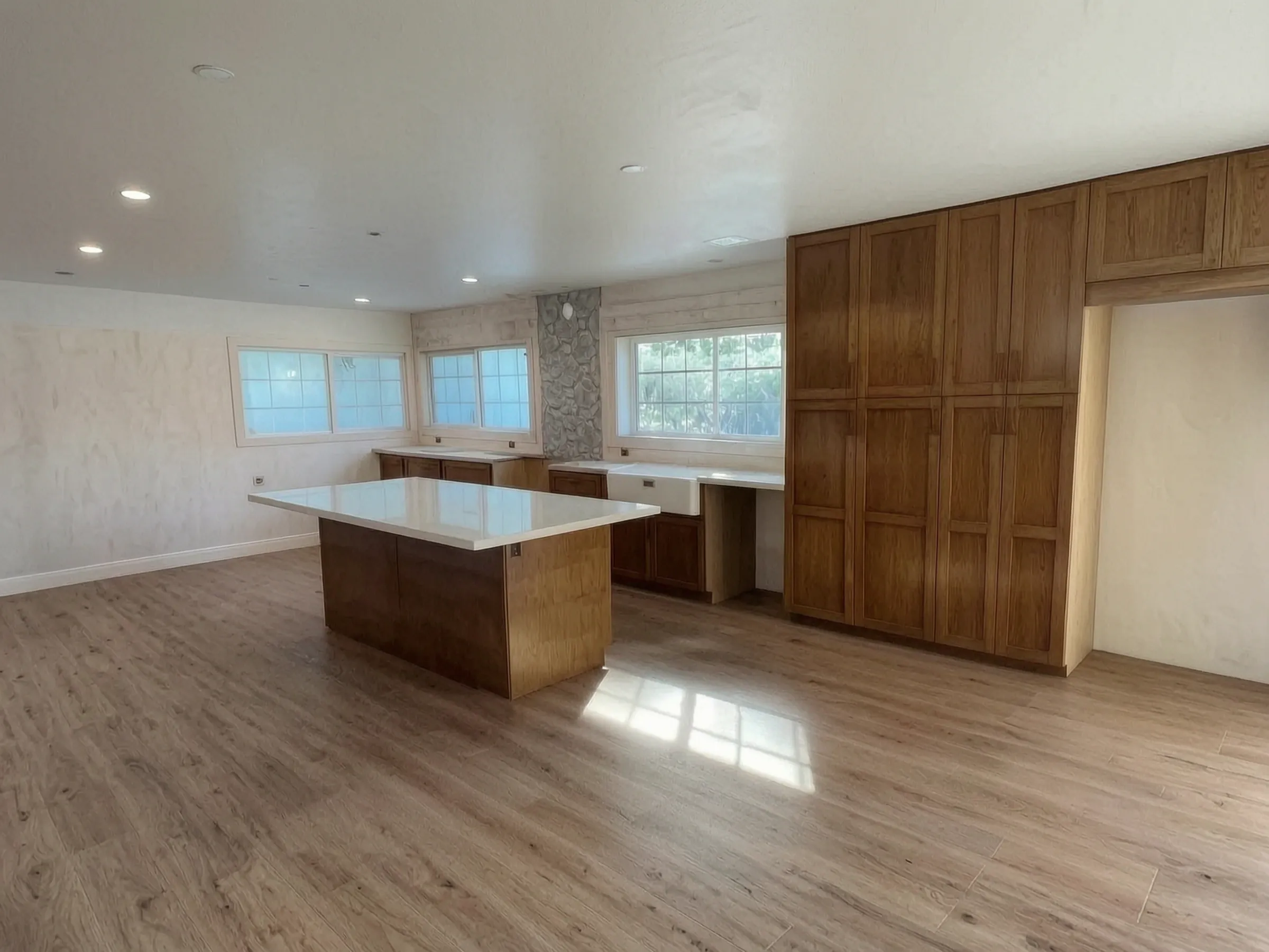 The finished open-plan kitchen of a whole-home remodel in Laguna Niguel, built by Avorino.