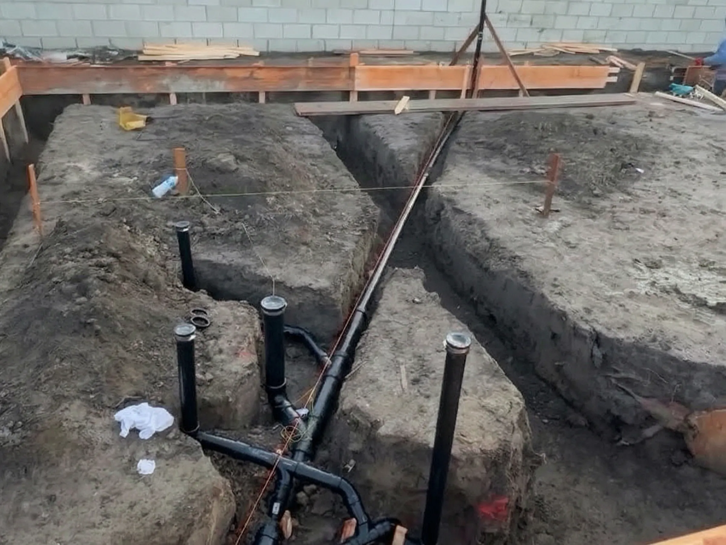 Plumbing laid in the footing trenches. New construction in Santa Ana, built by Avorino.