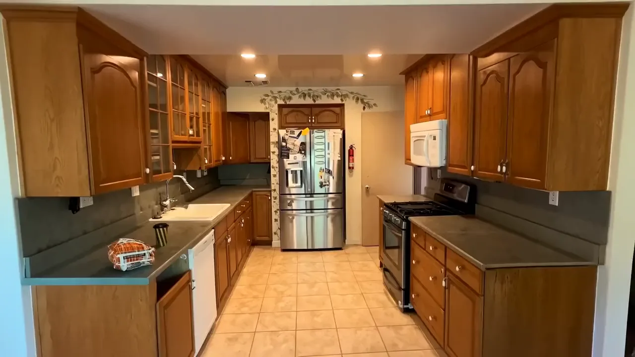 Time-lapse visualization of an Avorino kitchen remodel in Orange, from the honey-oak kitchen to the finished room
